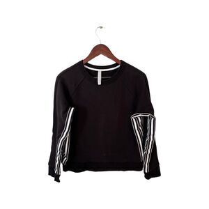 ATHLETA black crew neck sweatshirt with white inner arm stripe.